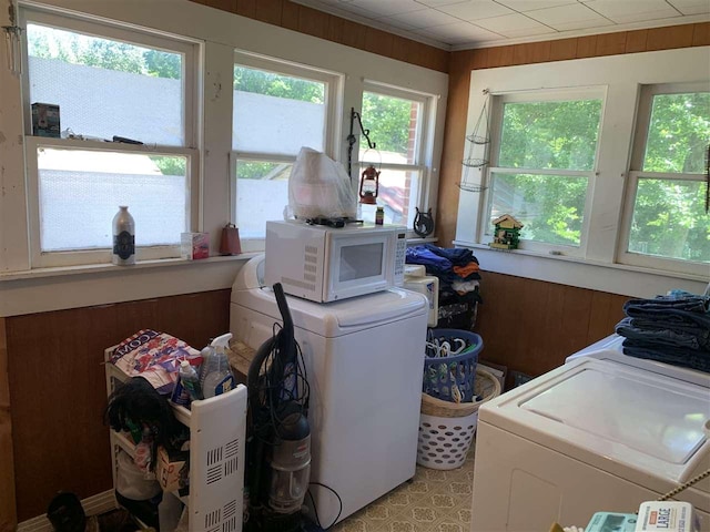 laundry area featuring washing machine and clothes dryer and plenty of natural light