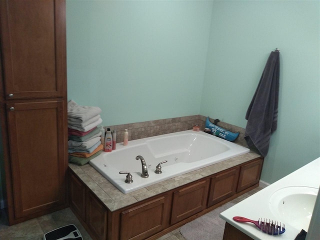 bathroom featuring a bath, tile flooring, and sink