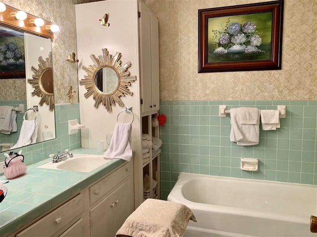 bathroom featuring a washtub and oversized vanity