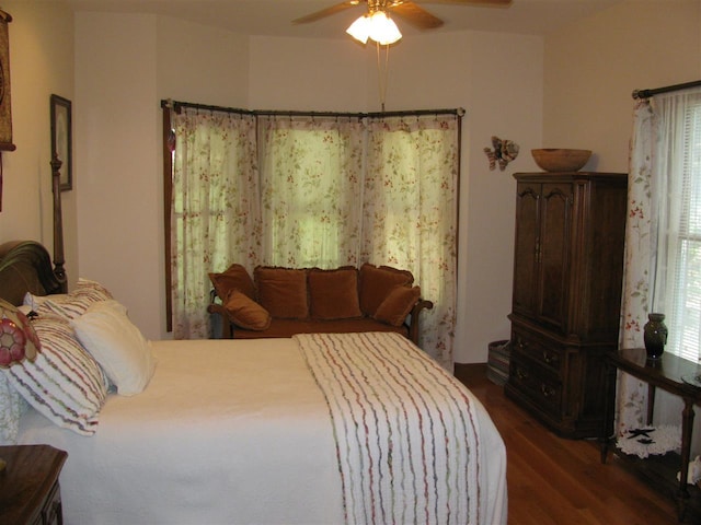 bedroom featuring dark hardwood / wood-style flooring and ceiling fan