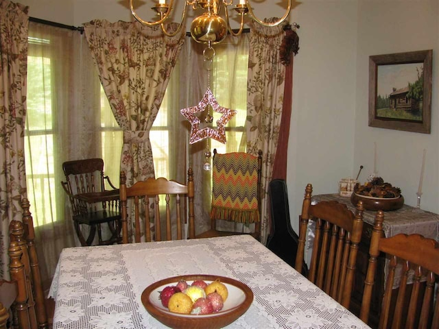 dining space featuring a chandelier