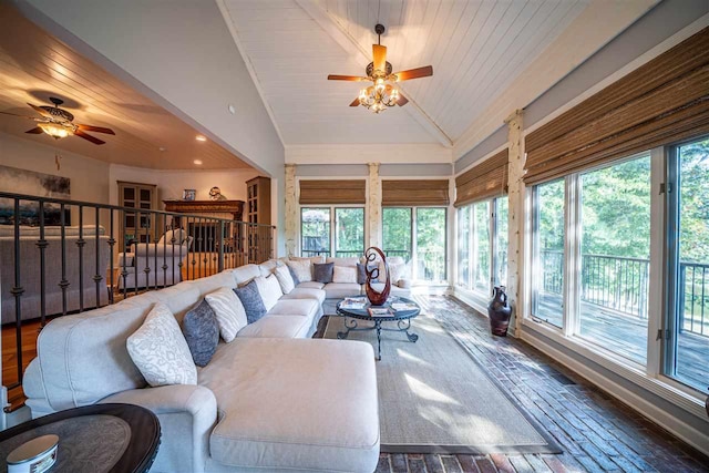 living room with ceiling fan, vaulted ceiling, and wooden ceiling