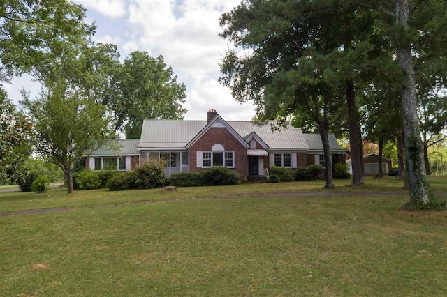 ranch-style home with a front lawn