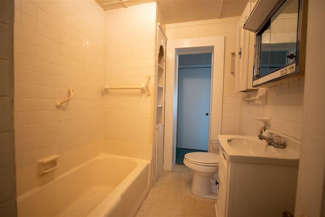 full bathroom featuring crown molding, tile flooring, toilet, tiled shower / bath, and large vanity