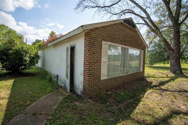 view of property exterior with a lawn