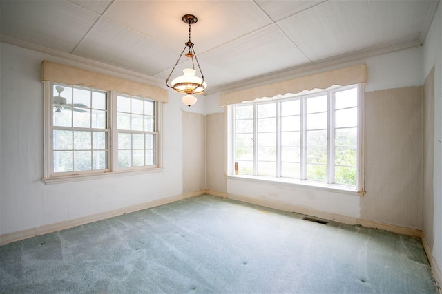 carpeted empty room featuring ornamental molding