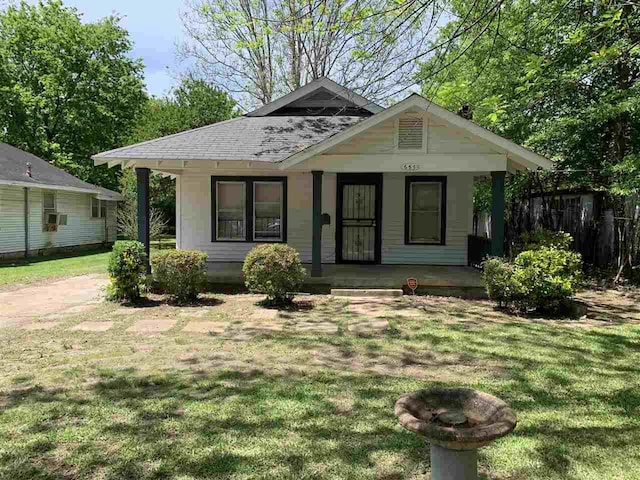 bungalow-style house with a porch and a front yard