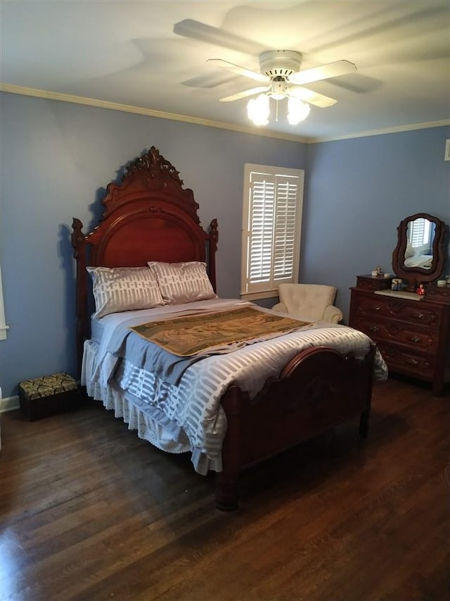 bedroom featuring ceiling fan, ornamental molding, and dark hardwood / wood-style floors