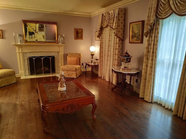 living room featuring ornamental molding and dark hardwood / wood-style flooring