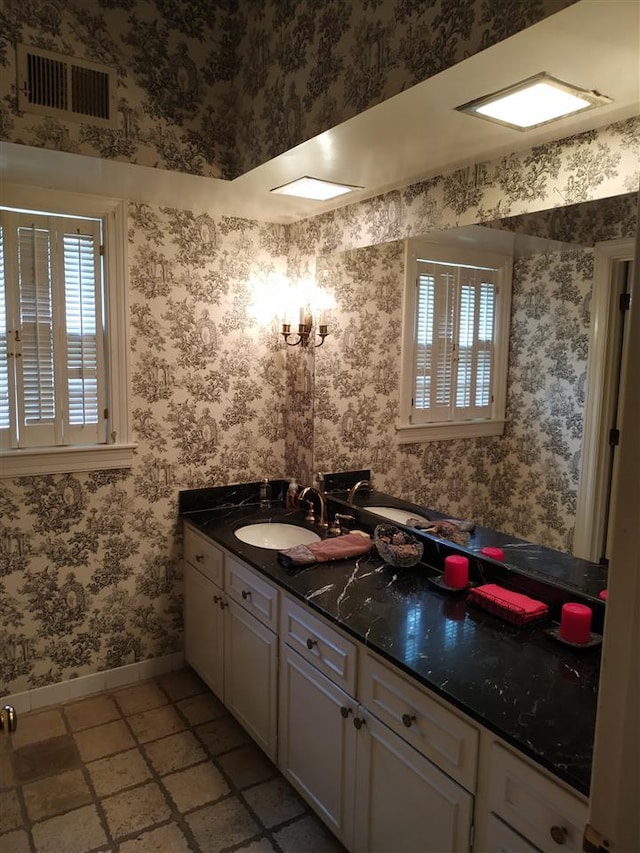 bathroom with tile floors and vanity