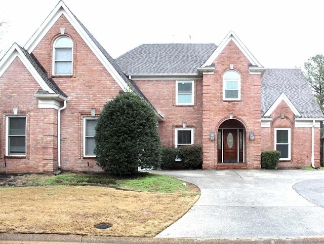 view of property featuring a front yard