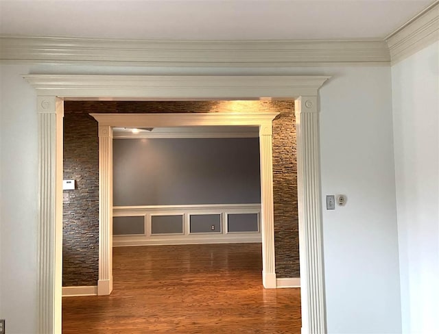 hall featuring crown molding and dark hardwood / wood-style floors