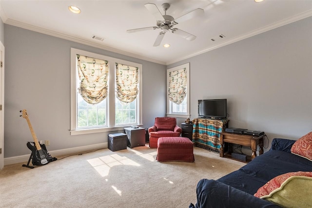 carpeted living room featuring ornamental molding and ceiling fan