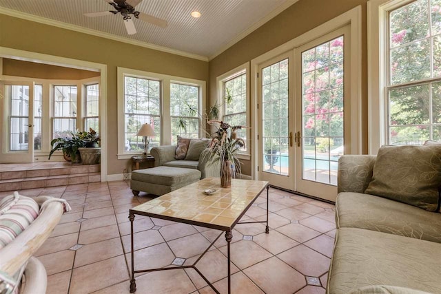 sunroom featuring ceiling fan, french doors, and a wealth of natural light