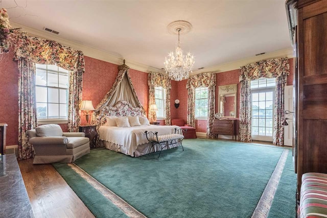 carpeted bedroom with crown molding and an inviting chandelier