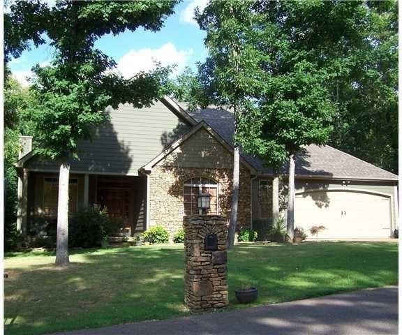 view of front facade with a front lawn and a garage