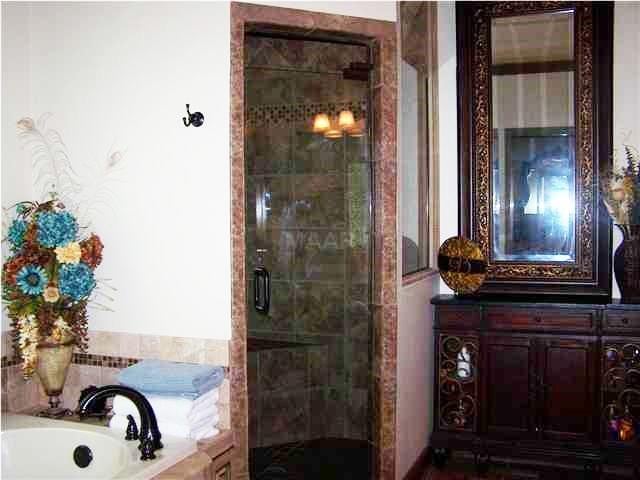bathroom featuring shower with separate bathtub and vanity