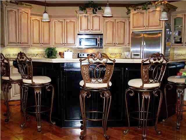 interior space with appliances with stainless steel finishes, decorative light fixtures, and tasteful backsplash