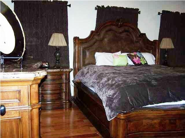 bedroom featuring dark hardwood / wood-style flooring