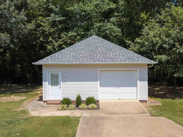 garage with a yard