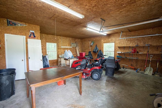 garage featuring a wall mounted air conditioner