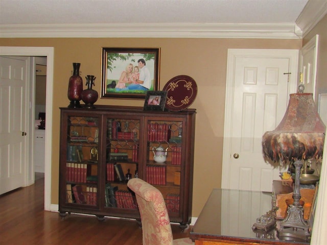 office space featuring ornamental molding and dark hardwood / wood-style flooring