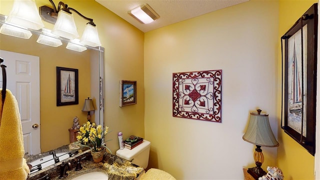 bathroom with sink and toilet