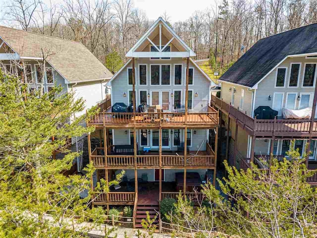 back of house with a wooden deck