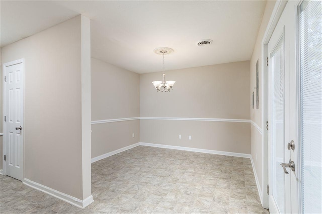 10736 Holly Grove Road, Gilt Edge, TN 38011 - empty room featuring a chandelier and light tile floors