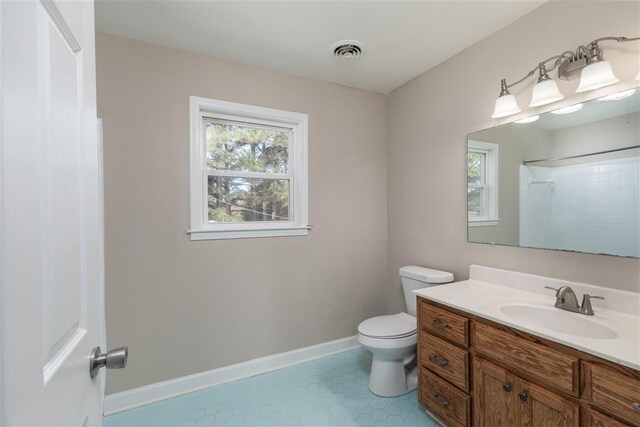10736 Holly Grove Road, Gilt Edge, TN 38011 - bathroom featuring vanity, tile floors, and toilet