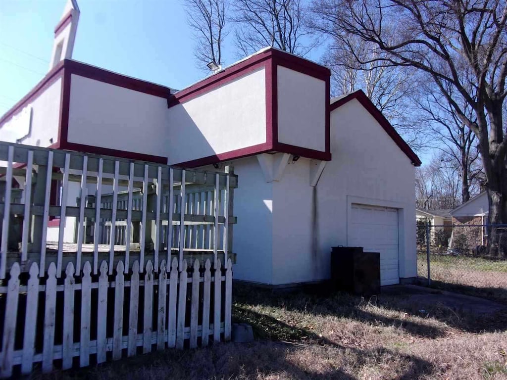 view of side of property featuring a garage