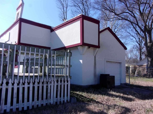 view of side of property featuring a garage