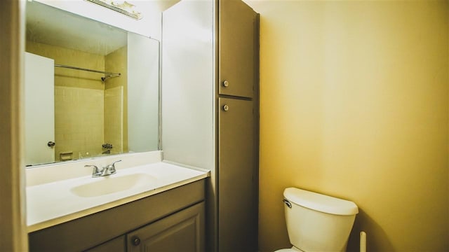 bathroom featuring toilet and vanity