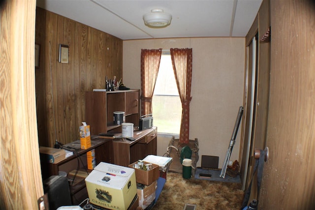 office area featuring wooden walls