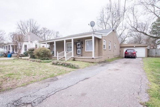 view of front facade featuring covered porch, a front lawn, and a garage