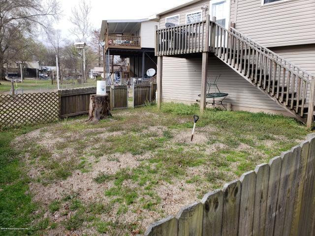 view of yard featuring a wooden deck