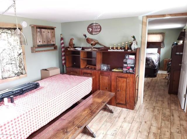 bedroom with light hardwood / wood-style floors