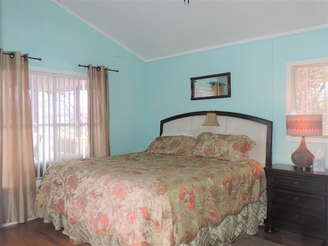 bedroom with crown molding, vaulted ceiling, dark wood-type flooring, and multiple windows