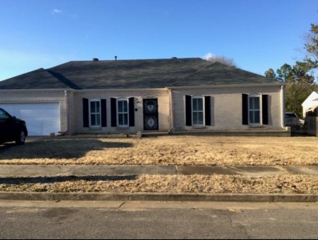 ranch-style home with a garage