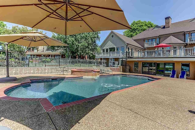 view of swimming pool featuring a patio area