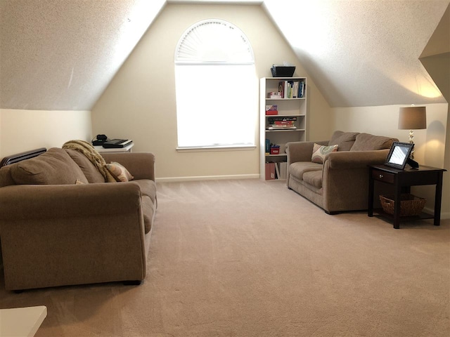 carpeted living room featuring a textured ceiling and vaulted ceiling