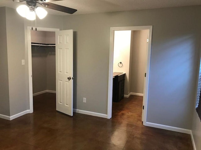 2103 Campground Road, Munford, TN 38058 - unfurnished bedroom with dark tile flooring, a closet, and ceiling fan