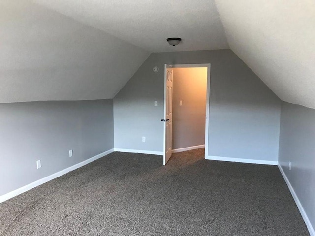 2103 Campground Road, Munford, TN 38058 - bonus room with dark colored carpet, vaulted ceiling, and a textured ceiling