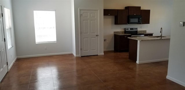 2103 Campground Road, Munford, TN 38058 - kitchen featuring light stone counters, dark tile floors, dark brown cabinets, stainless steel electric stove, and sink