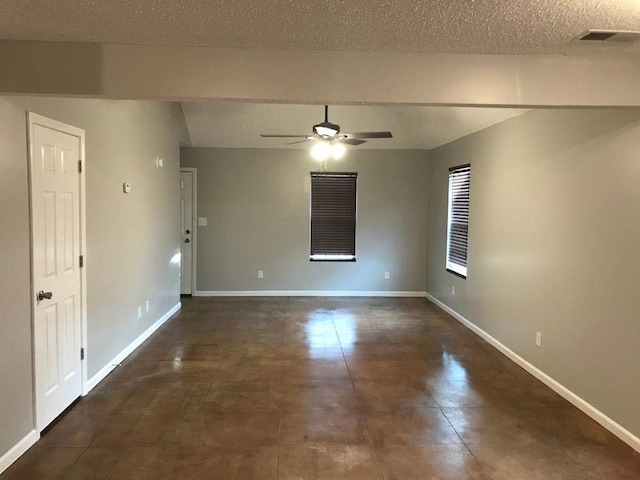 2103 Campground Road, Munford, TN 38058 - tiled spare room featuring beam ceiling, a textured ceiling, and ceiling fan
