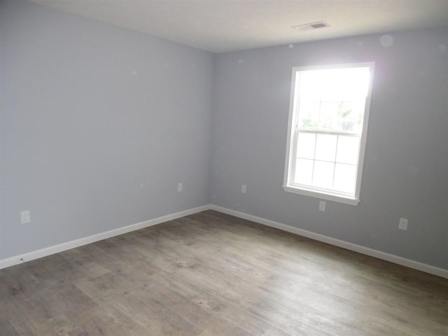 unfurnished room featuring light wood-type flooring