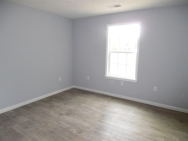 empty room with wood-type flooring