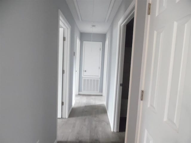 corridor featuring light hardwood / wood-style floors