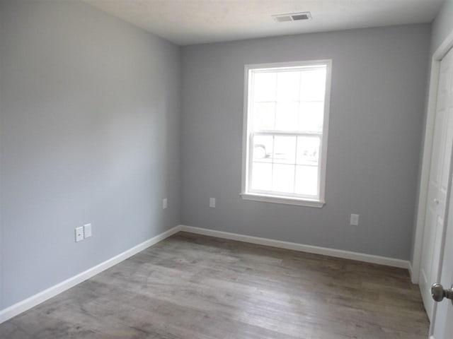 spare room featuring light hardwood / wood-style floors