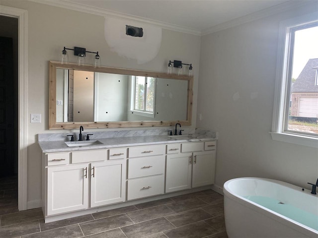 bathroom featuring plenty of natural light, tile flooring, crown molding, and dual bowl vanity